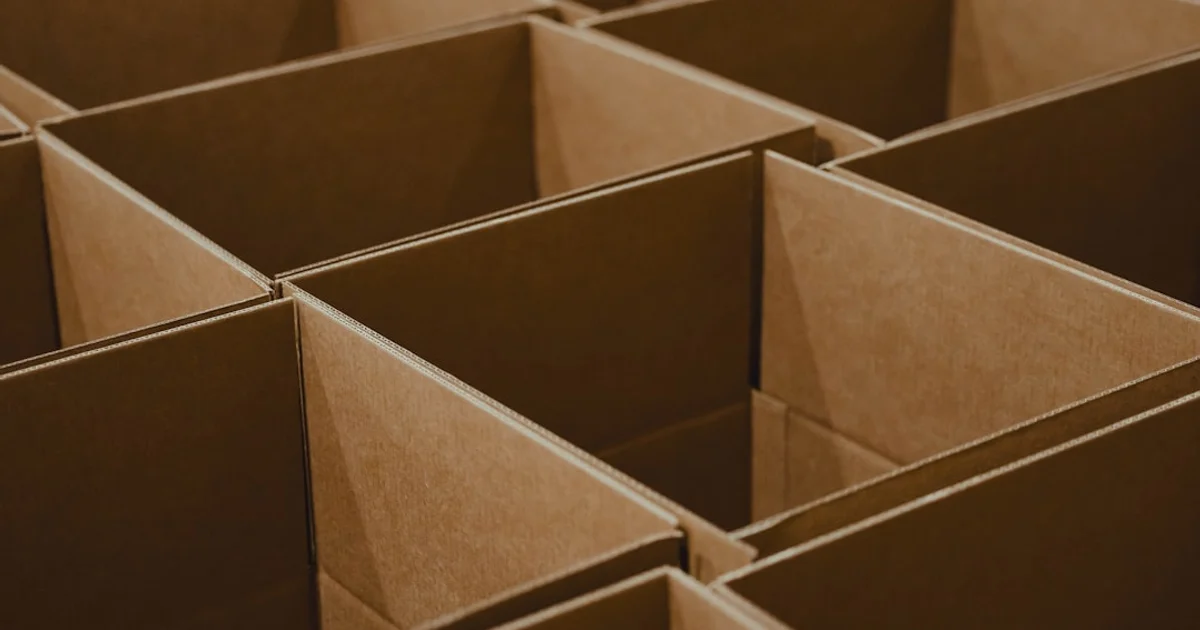 A grid of empty open cardboard shipping boxes, viewed from above