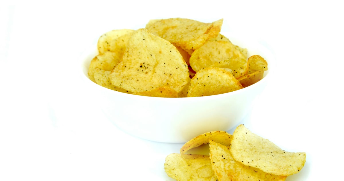Stack of flavoured crisps with ingredient label showing E631 and E627 flavour enhancers
