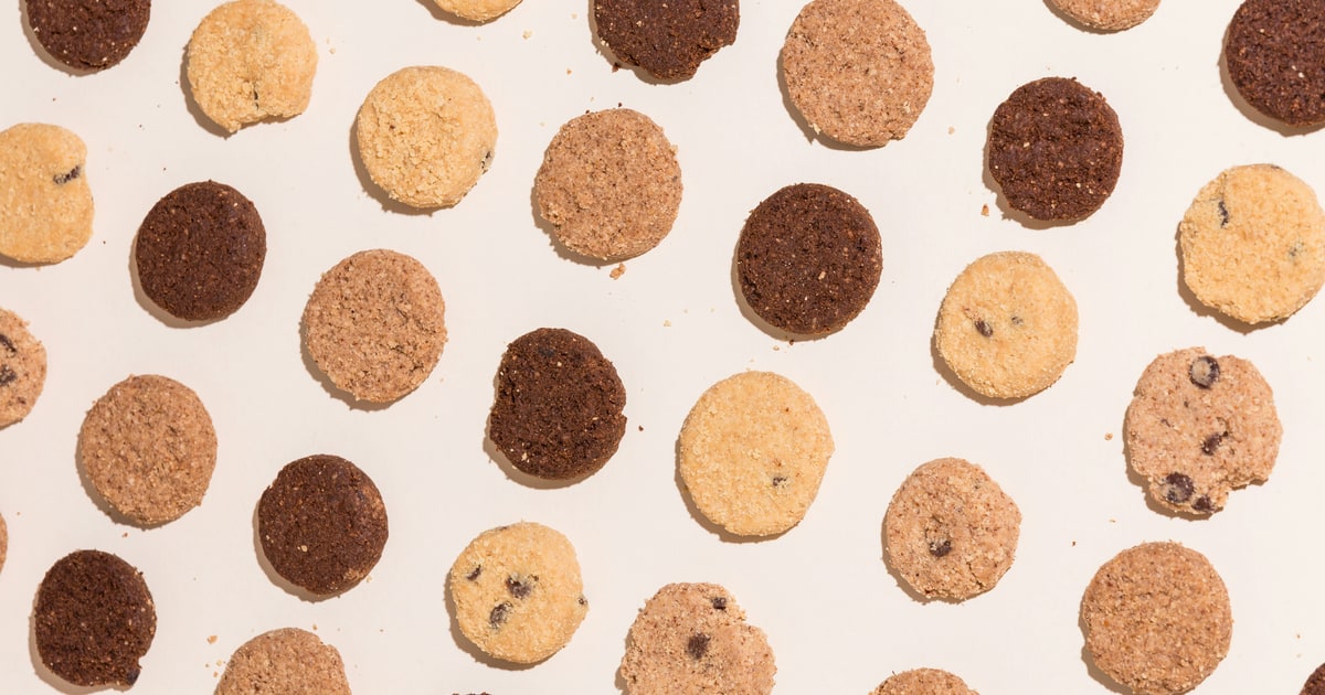 Assorted biscuits and cookies laid out on a white surface