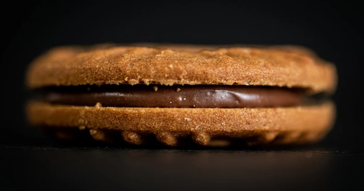 Assorted imported biscuits and wafers on a shelf, representing bakery products searched by Egyptian shoppers