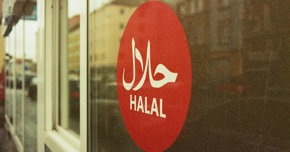 UK restaurant kitchen with halal certification certificate on the wall — HMC and HFA certification guide