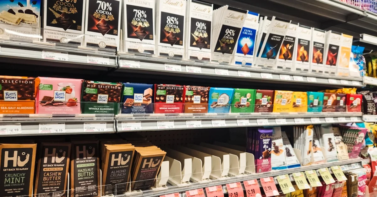 Chocolate bars on a supermarket shelf, representing imported chocolate available in Uzbekistan
