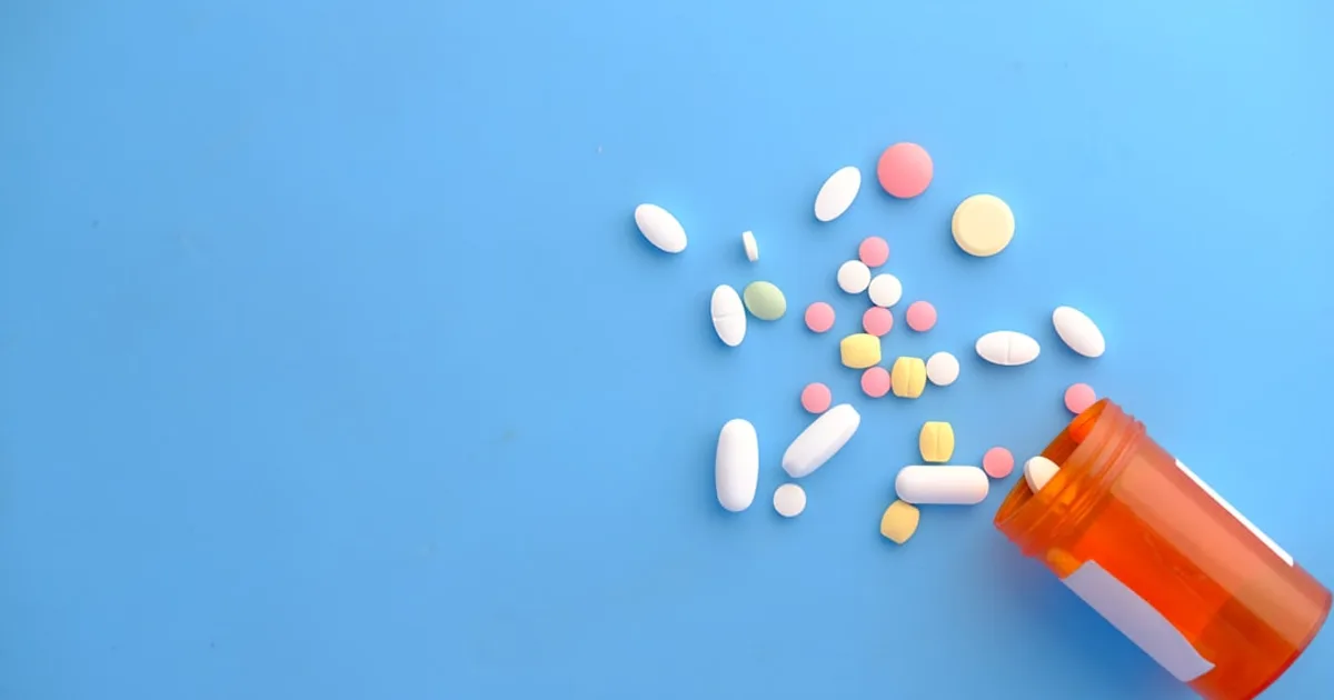 Elderly Muslim checking medication capsule label — halal guide for seniors