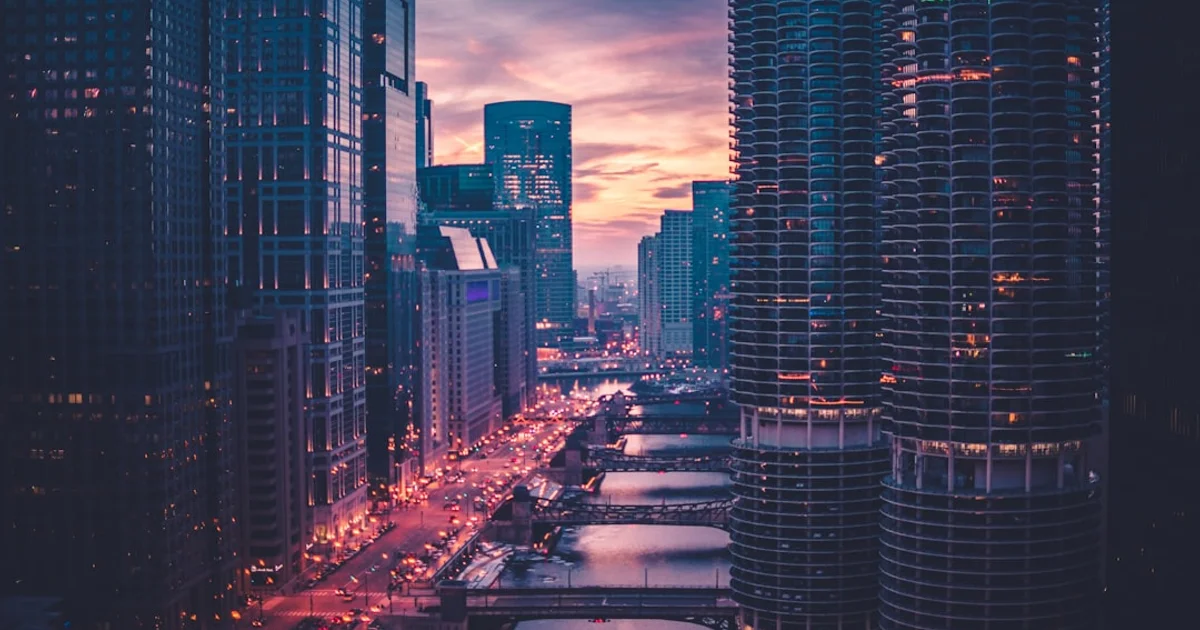 Chicago high-rise skyline and river bridges glowing at dusk
