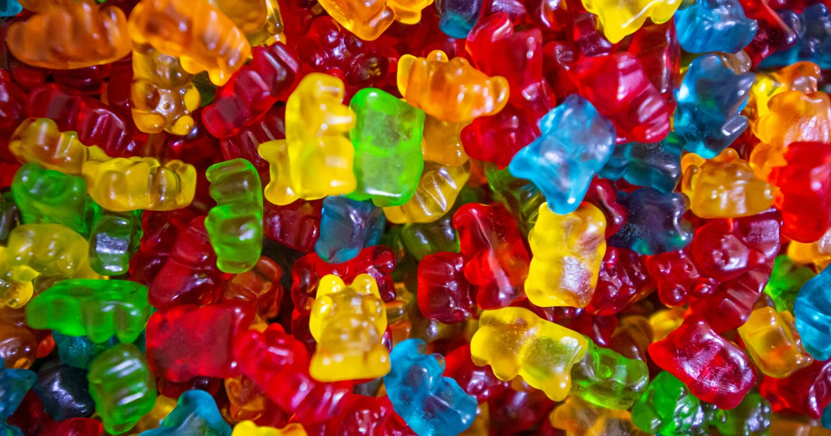 Colourful gummy bears and pick n mix sweets in clear bags