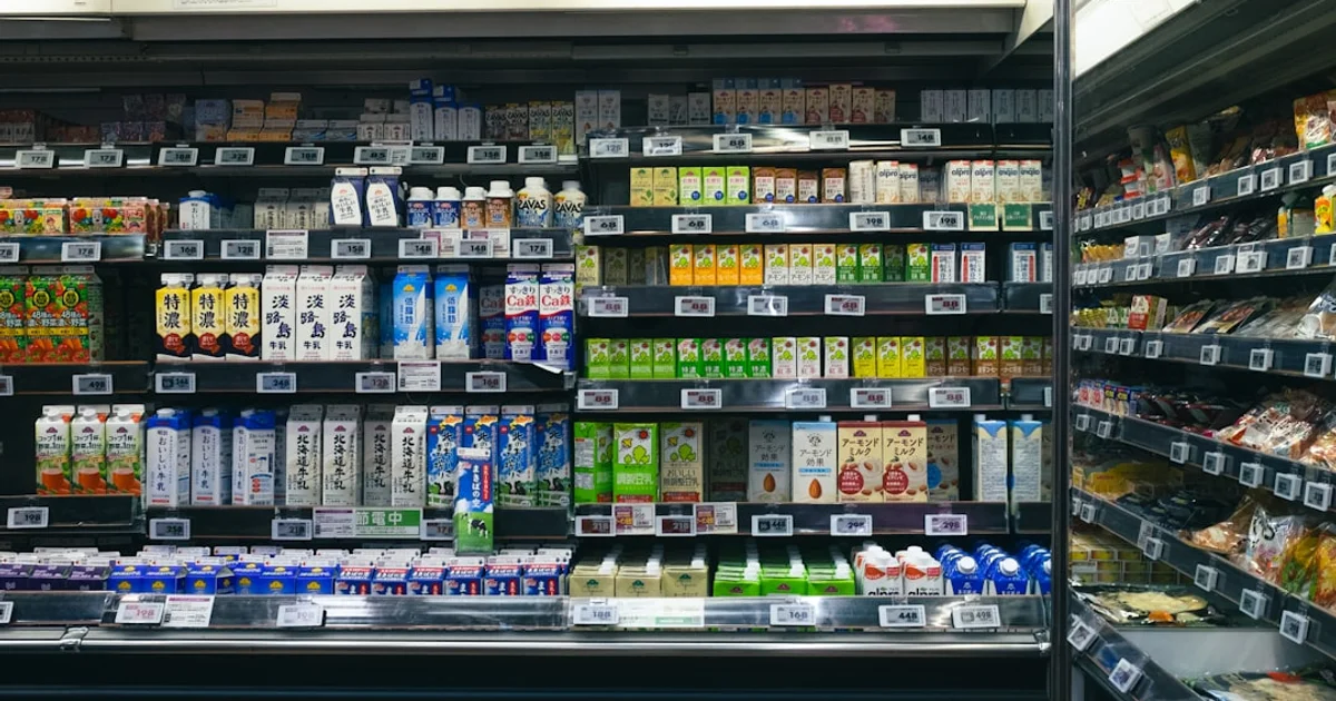 Supermarket chiller cabinet of milk cartons and ice cream tubs in Hong Kong