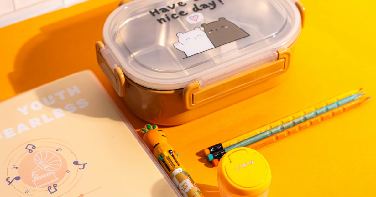 Halal packed lunch for school with labelled food items and snacks in a lunchbox