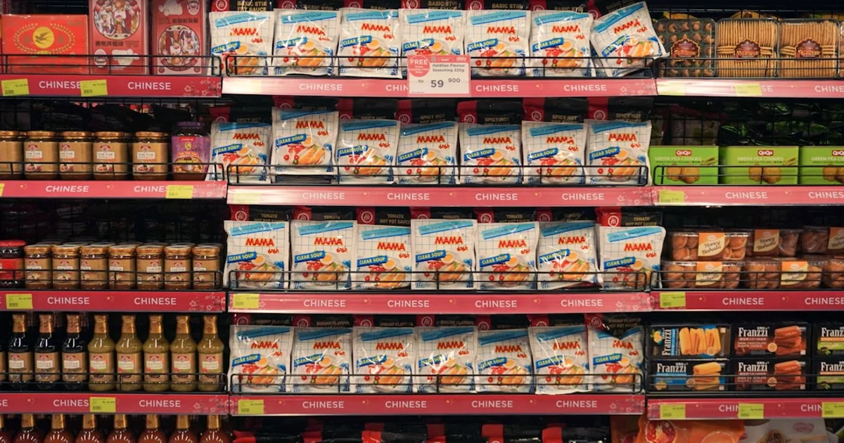 Supermarket aisle with chilled meat and deli products in the Netherlands, Albert Heijn halal shopping guide