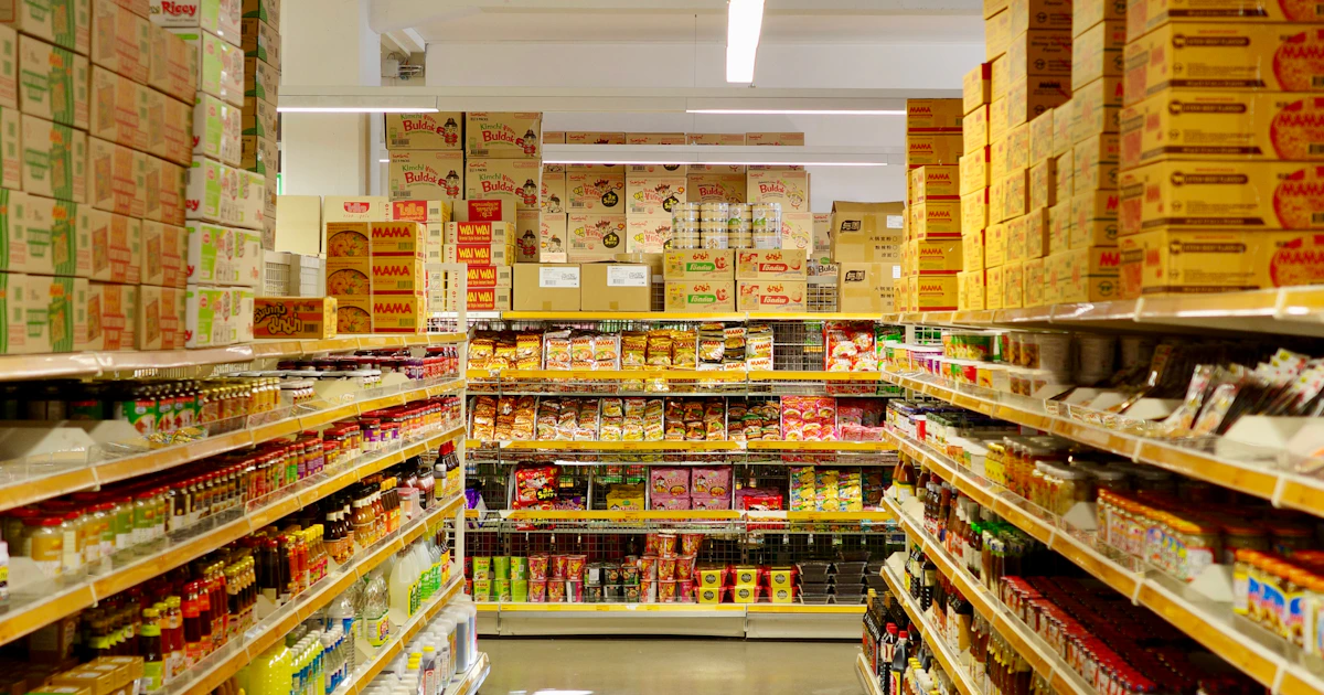 Coles supermarket aisle in Australia with halal certification logos on meat products