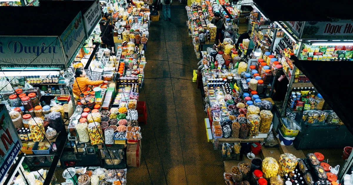 Muslim shopper at Sainsbury's checking food labels for halal verification