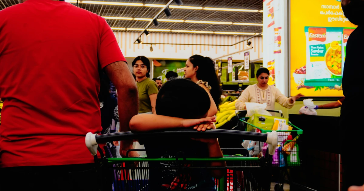 Muslim shopper checking food labels at Woolworths Australia for halal verification