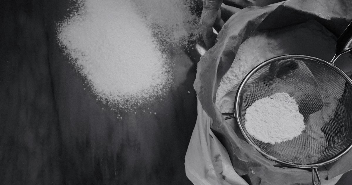 Tin of baking powder with measuring spoon — is baking powder halal?