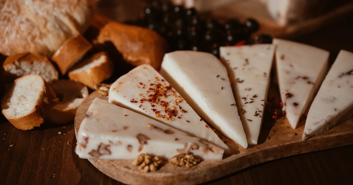 A wedge of hard cheese beside a label showing rennet type — is cheese halal or haram?