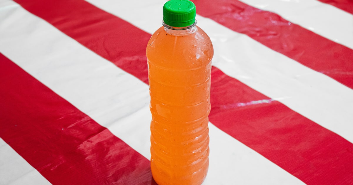 Orange fizzy drink bottle — E110 Sunset Yellow is commonly used in orange-coloured drinks and sweets