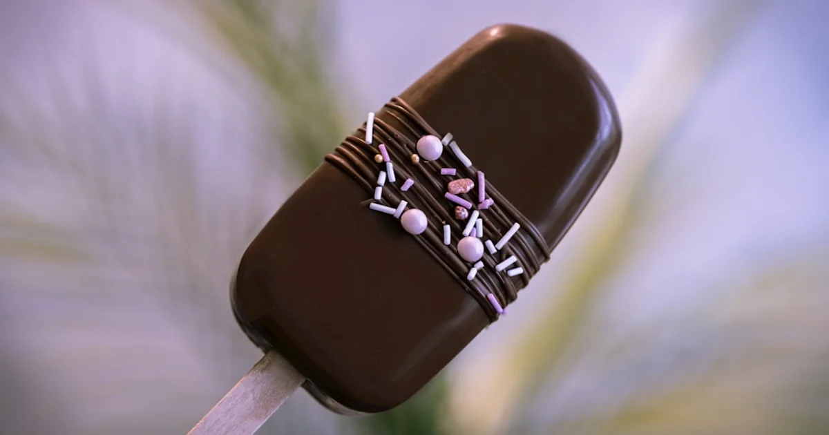 Magnum Classic ice cream bar unwrapped showing chocolate coating — is it halal?