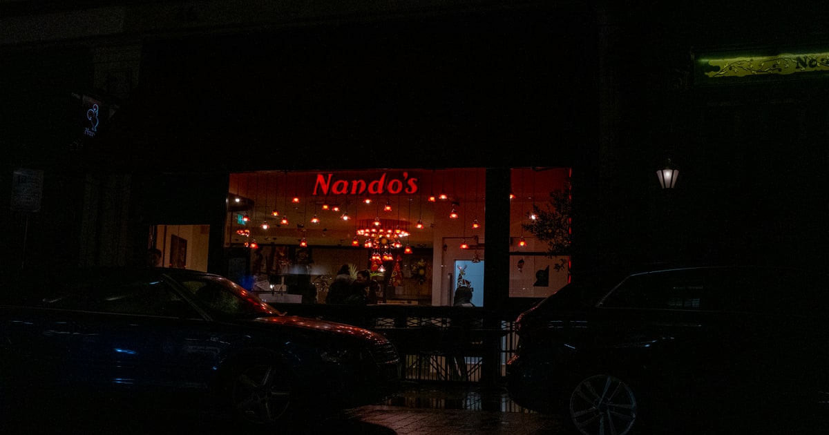 Nando's restaurant interior with the iconic rooster logo