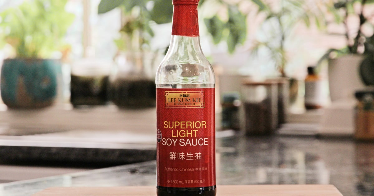 Bottle of oyster sauce next to Asian stir-fry ingredients — is oyster sauce halal?