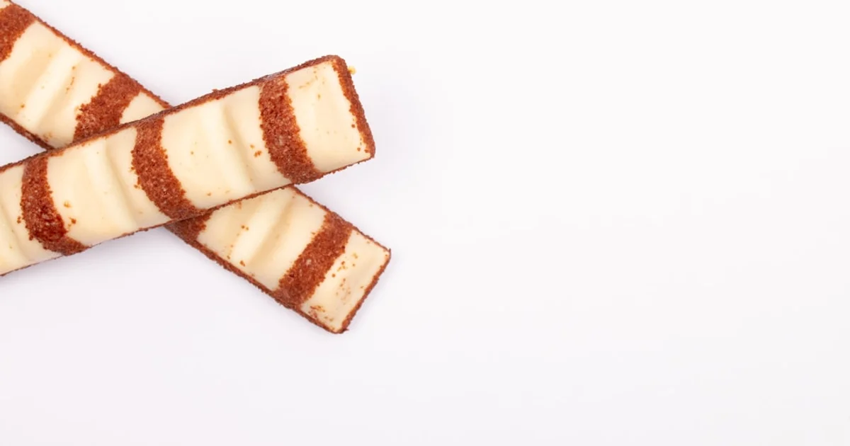 Cream-filled wafer rolls similar to Roshen Konafetto, stacked close up