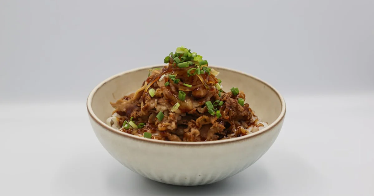 Crispy fried shallots in a bowl, a common Asian condiment