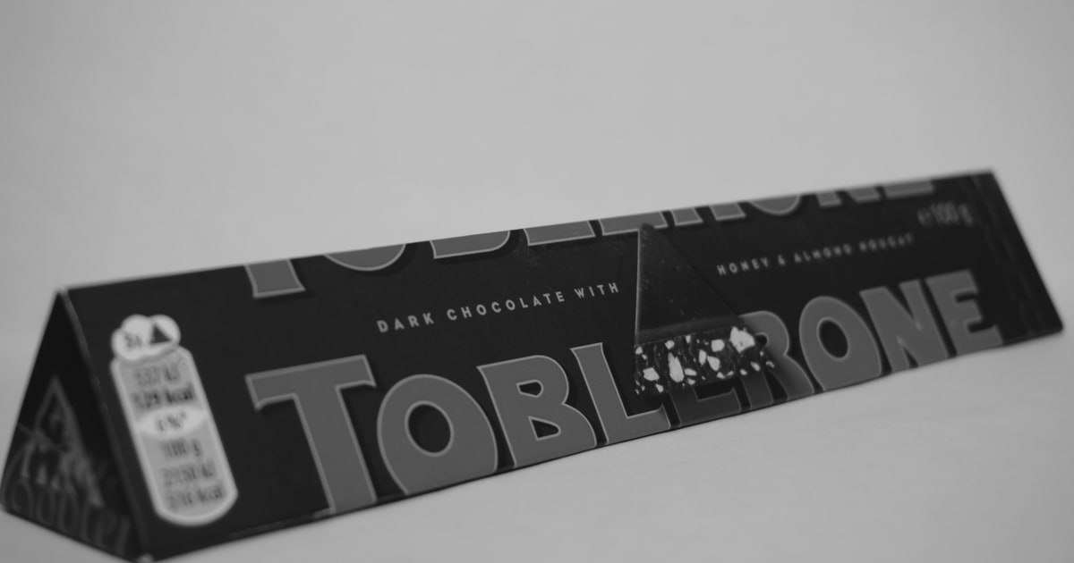 Iconic triangular Toblerone chocolate bar in yellow packaging