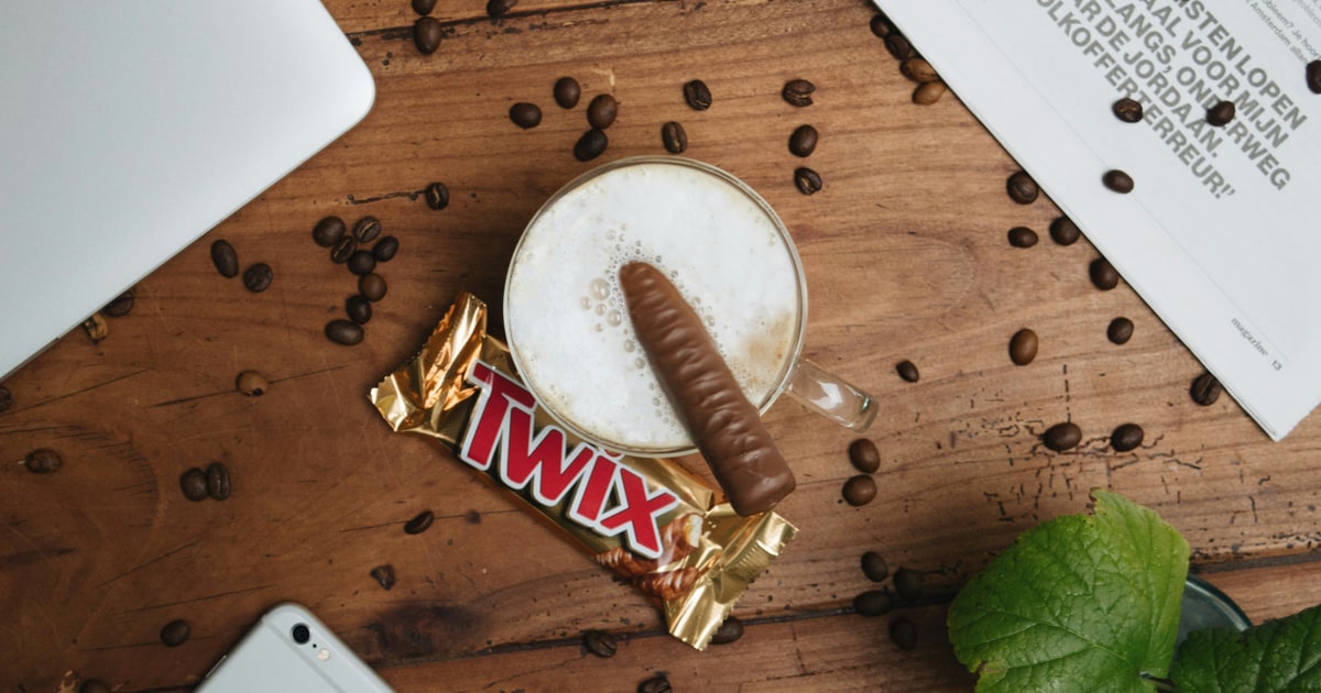 Twix chocolate bar with biscuit and caramel layers on a wrapper