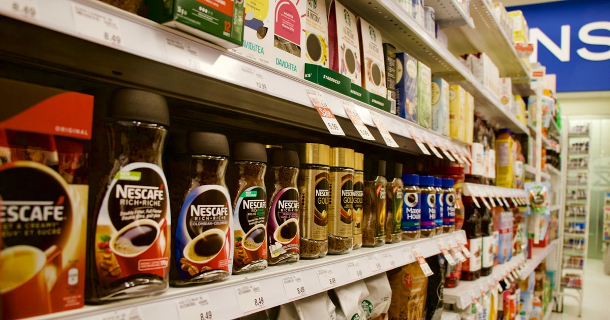 Food products on a UK supermarket shelf with mushbooh halal status question marks