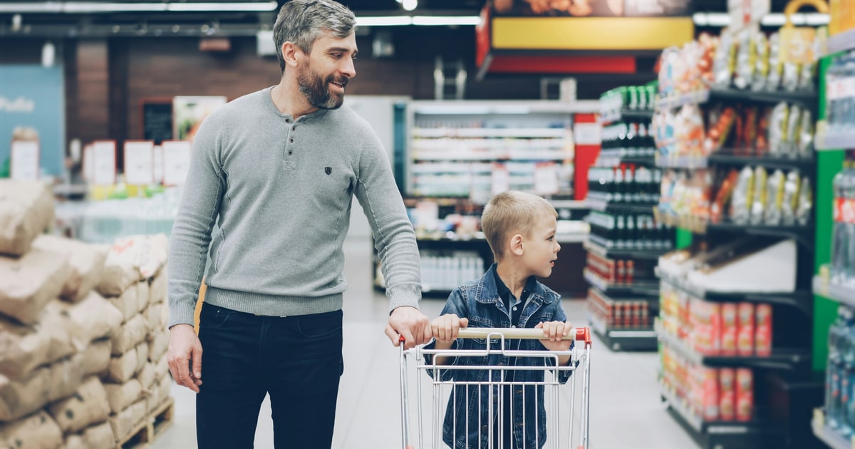 Father and son shopping together in a supermarket — a quick halal label system saves time every trip